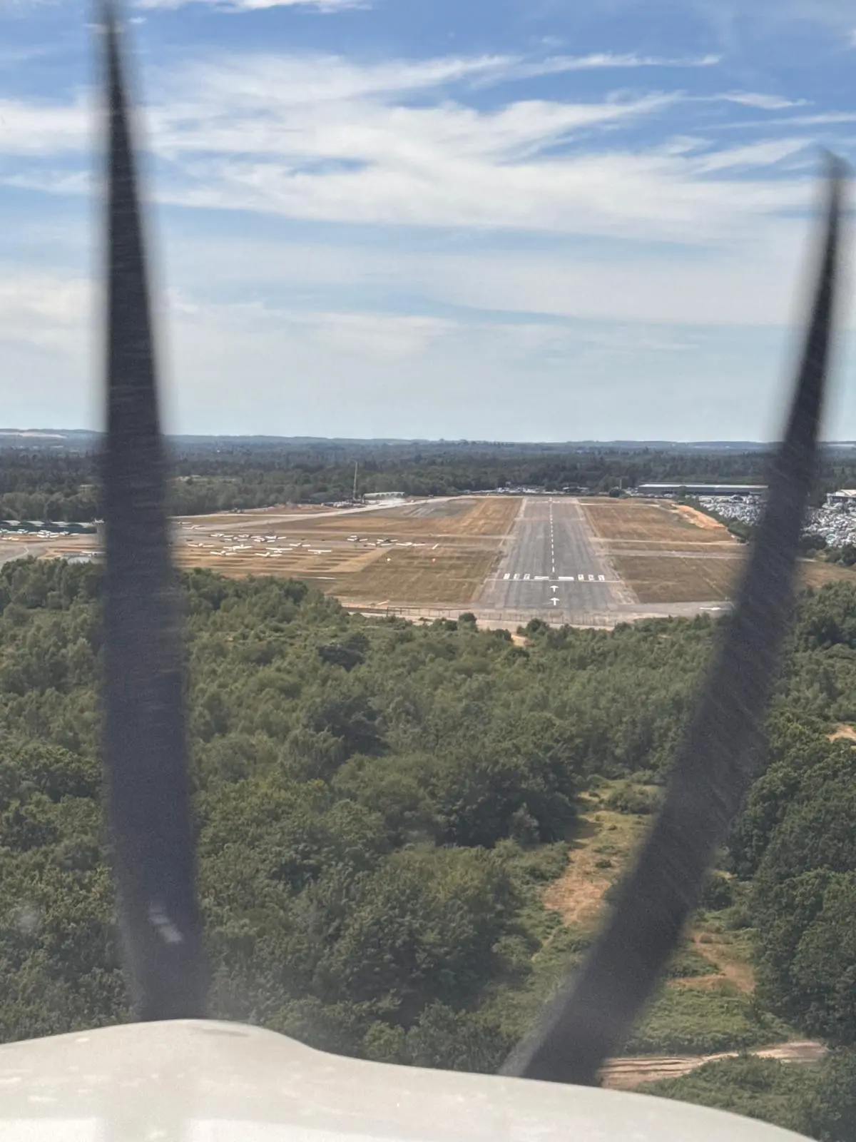 Final approach to Runway 25 at Blackbushe
