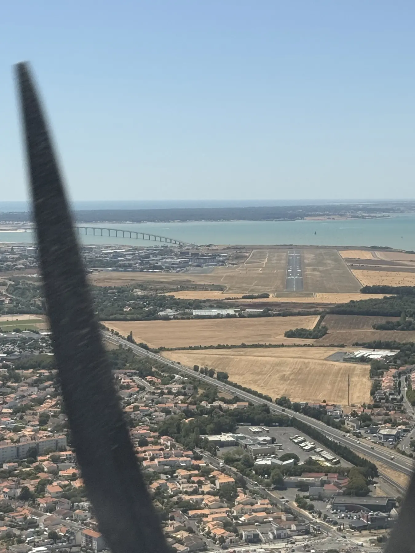 Final approach to Runway 27 at La Rochelle with the Île de Ré bridge beyond
